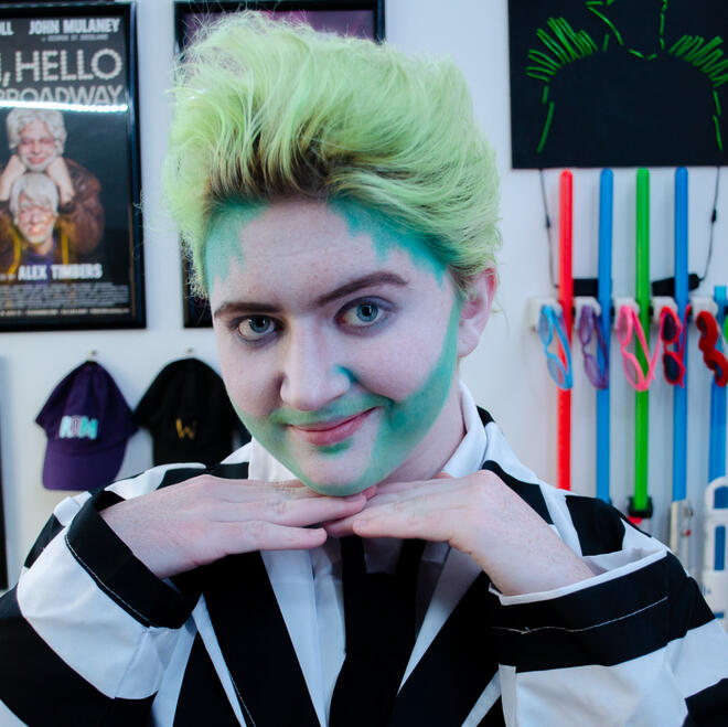 Brie, dressed as Beetlejuice from the Broadway Musical, looking into the camera.